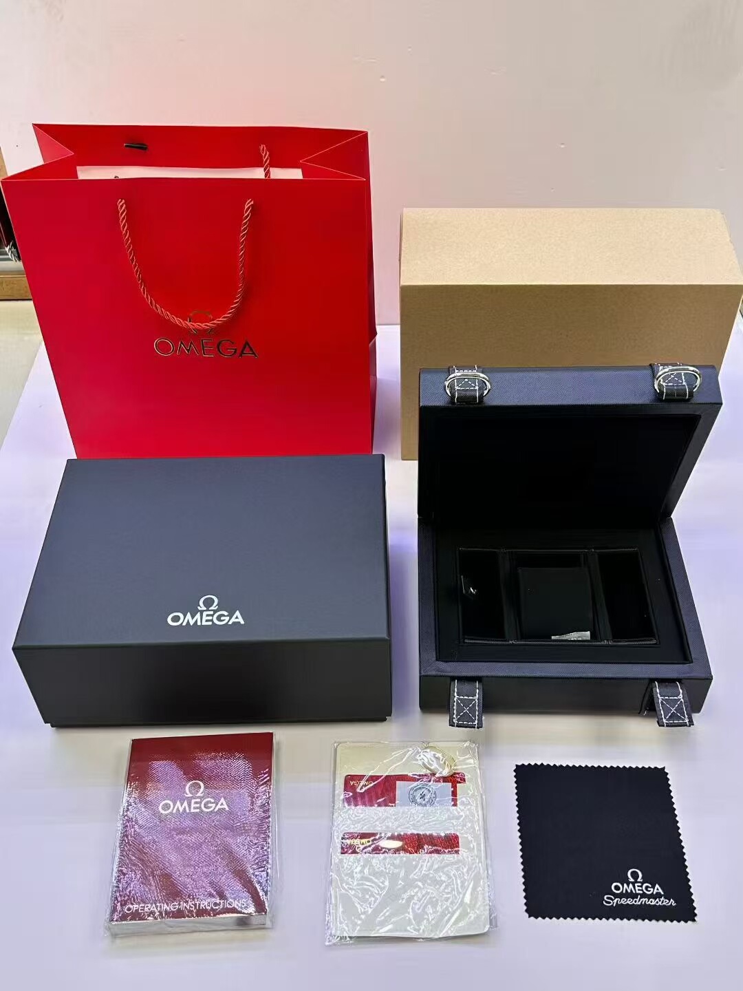Omega Speedmaster Watch Box Set Complete Omega Speedmaster watch box set with red gift bag